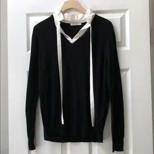 A black Sandro Paris sweater